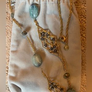 Alexis Bittar gold and blue leaf long chain necklace.